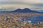 Panoramic city view over Seaport of Napoli with ships and Mount Vesuvius volcano, seen from Sant Elmo castle, Naples, Campania, Italy, Europe