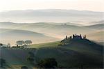 Podere Belvedere and misty hills at sunrise, Val d'Orcia, San Quirico d'Orcia, UNESCO World Heritage Site, Tuscany, Italy, Europe