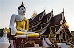 The Buddha and Wat Rajamontean with a sunburst, Chiang Mai, Thailand, Southeast Asia, Asia