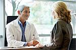 Doctor consulting patient in clinic