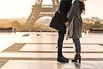 Couple kissing each other at Eiffel Tower