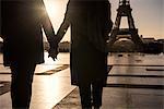Couple walking towards Eiffel Tower