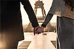 Couple walking towards Eiffel Tower