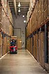 Worker operating forklift truck