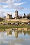 Old Campden House and St. James' church reflected in pond, Chipping Campden, Cotswolds, Gloucestershire, England, United Kingdom, Europe