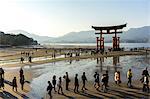 The red wooden torii gate at low tide on Miyajima island, Itsukushima, UNESCO World Heritage Site, Hiroshima Prefecture, Honshu, Japan, Asia