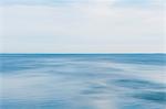 Blue seascape abstract, view over calm water, graduated colours of the sea.
