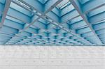 The roof of a building, a grid pattern and turquoise blue lights and sprinklers, fire safety precautions.