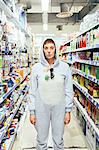 Portrait of woman wearing adult bodysuit in supermarket isle, looking at camera