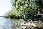 Boy running in water, Kingston, Canada