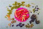 Black and white grapes, plums, apples and watermelon slices