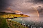 Scenic view of Coumeenole Beach with rainbow, Slea Head Drive, Dingle, Kerry, Ireland