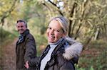 Portrait smiling, happy mature couple holding hands in park