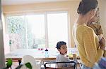 Mother and sons in dining room