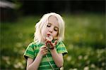 Boy blowing dandelion