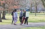 Female runners talking in park