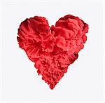 Red ink forming heart-shape on white background