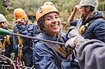 Portrait smiling woman zip lining