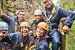 Portrait smiling, confident friends zip lining