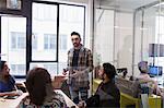 Businessman leading conference room meeting