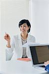 Japanese senior businesswoman having meeting in the office