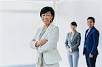 Japanese senior businesswoman with her team