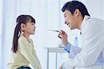 Japanese doctor with a patient in his studio