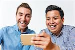 International friends enjoying content on a smartphone
