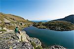 Hiking next to one of the Maliovitsa lakes in the Rila Mountains, Bulgaria, Europe