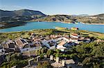 View of white village and turquoise coloured reservoir, Zahara de la Sierra, Sierra de Grazalema Natural Park, Andalucia, Spain, Europe