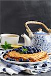 Healthy vegan pancakes crepe with blueberry.