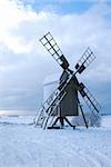 Old wooden windmill in a great landscape at winter season on the swedish island Oland - the island of sun and wind