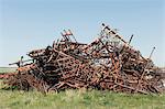 Pile of discarded farming equipment in rural landfill, near Kildeer, Saskatchewan, Canada.