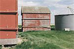 Old farm outbuildings on prairie,