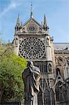 A statue of St. John Paul next to Notre-Dame Cathedral on the Ile de la Cite. Paris, France, Europe