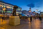 View of Bear and Strawberry Tree statue and Puerta Del Sol at dusk, Madrid, Spain, Europe