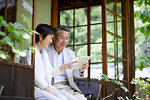 Japanese senior couple having fun at traditional inn