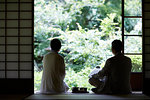 Japanese senior couple having fun at traditional inn