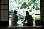 Japanese senior couple having fun at traditional inn