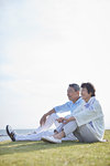 Japanese senior couple having fun by the sea