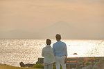 Japanese senior couple having fun by the sea