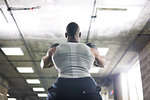 Man lifting kettlebells in gym