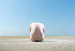 Nude man on sandbank