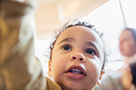 Close up cute, curious baby boy looking up