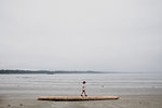 Girl on beach, Tofino, Canada