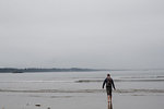 Man on beach, Tofino, Canada