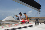 Man and woman on sailing boat, British Virgin Islands