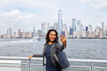 Businesswoman taking selfie, New York, US
