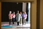Serene active seniors practicing yoga in circle
