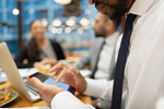 Close up businessman using smart phone in cafe